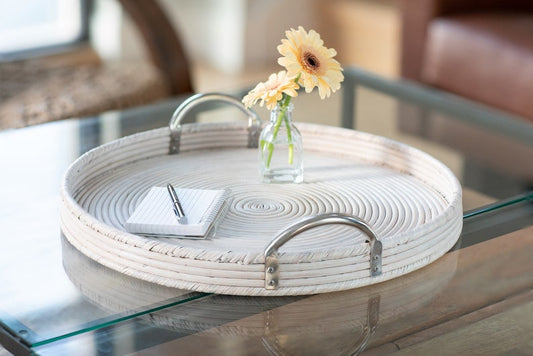 Round wicker tray w/stainless steel handles.